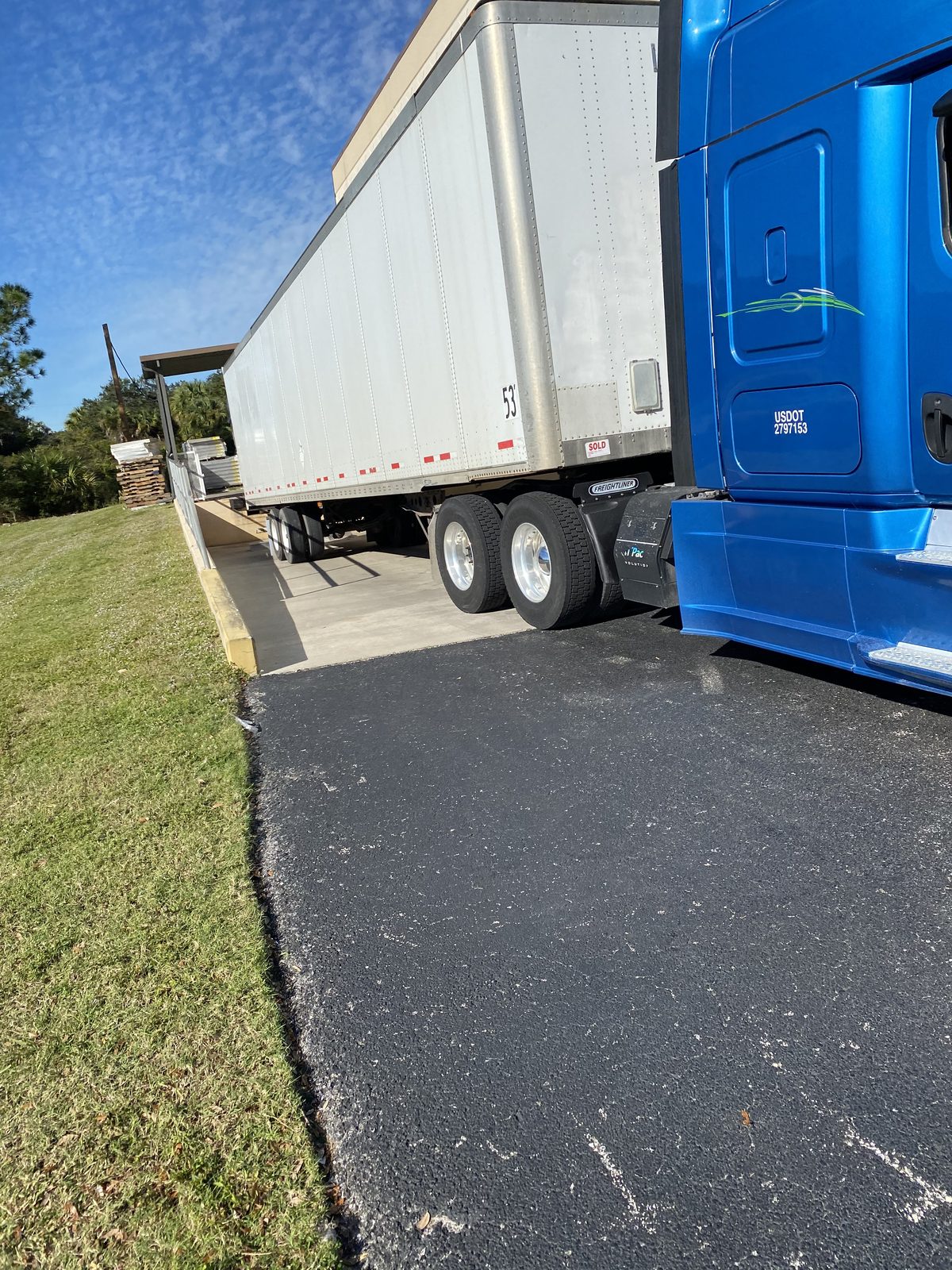 National Logistics Group tractor hooked to a 53-foot dry van trailer